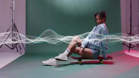 Camera rolling, model sitting on board posing with moving wave sweeping across Stock Footage 332867112