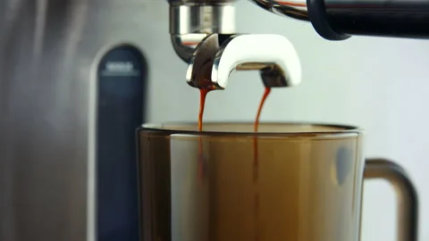 Camera rotate around cup. Coffee Machine filling up Cup with Espresso Stock Footage 90227924