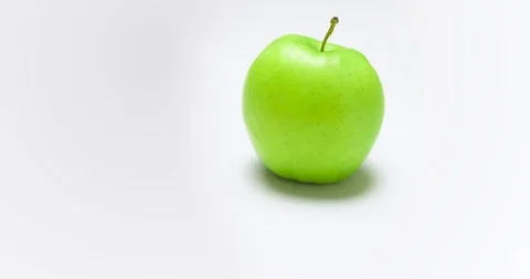 Camera rotated around the one green apple Stock Footage 126282030