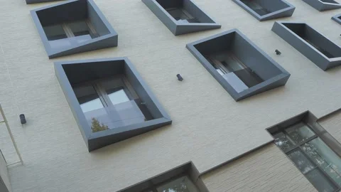 The camera rotates against the wall of the house with the original windows. Stock-Footage 187598637