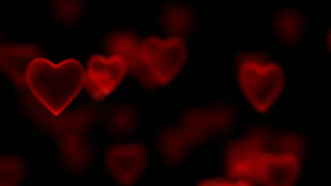 The camera rotates around an array of hearts. Focusing and defocusing on three Stock Footage 95579241