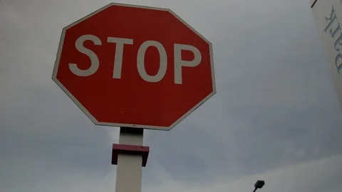 Camera rotates around city "STOP" sign. Stock Footage 101647939