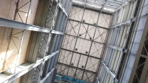 Camera Rotates Around Its Axis With Wide Angle View Of A Tall Industrial Buildin Stock-Footage 106615945