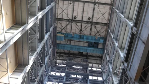 Camera Rotates Around Its Axis With Wide Angle View Of A Tall Industrial Buildin Stock-Footage 106615957