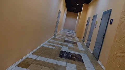 The camera rotates around its axis while passing through the empty corridor Stock Footage 116760229