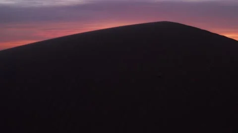 The camera rotates around a massive dune... Stock Video Pond5