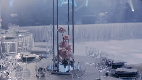 Camera rotates left to right around a wedding decorated table with a bouquet. Stock Footage 98737324