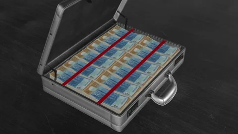 Camera rotates into an open briefcase packed with Uruguayan 50 peso notes, .. Stock Footage 325657446