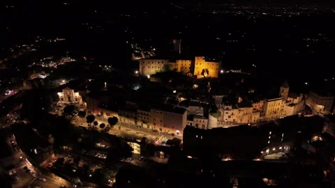 Camera rotating over illuminated medieval town at night Video stock 282659229