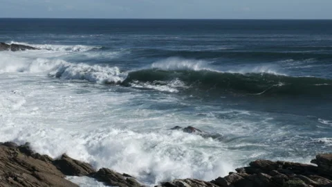 The camera runs along a long wave, as it breaks in the sea Stock Footage 160925776