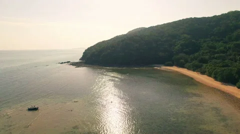 Camera runs along the mountains overlooking the sea at sunset. Aerial. N. Stock Footage 64701747