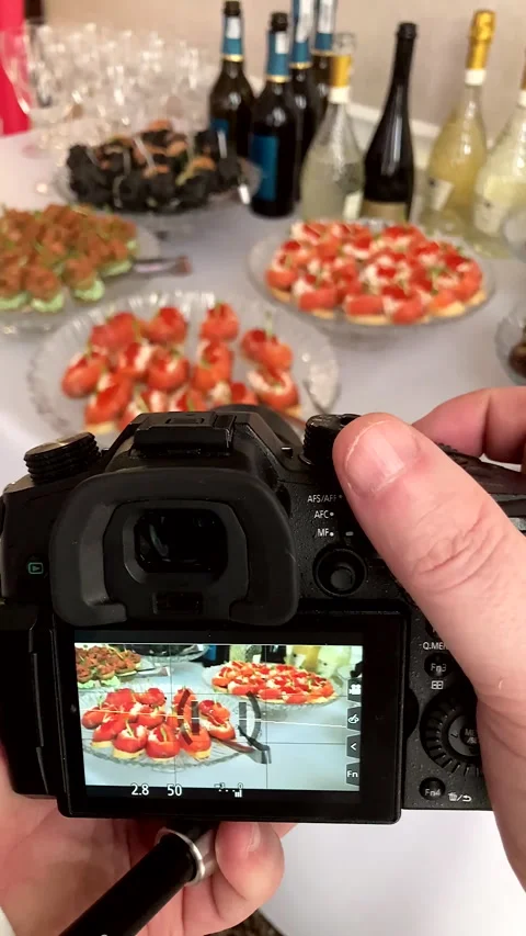 Camera screen captures a beautifully decorated banquet table with appetizers. Stock Footage 331707169