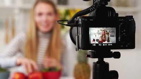 Camera screen recording - focus transition - Food blogger cooking fresh vegan Stock Footage 135785220