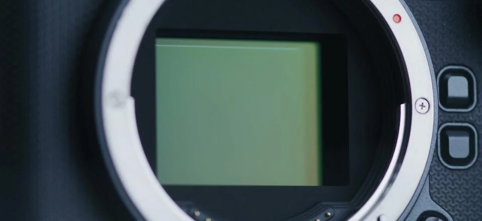 The camera sensor is revealed, showcasing its delicate internal. 写真素材