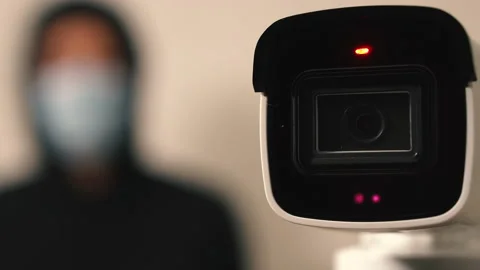 A camera with sensors measures a person's temperature during quarantine Stock Footage 138376610