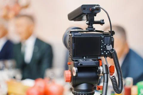 Camera set up for recording during a dinner event Stock Photos