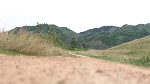 Camera seting under the passing ATV, between the wheels on the dirty road 動画素材 81672274