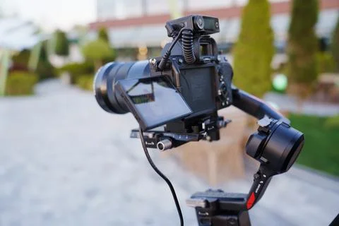 Camera setup with gimbal stabilizer in a scenic outdoor location Stock Photos