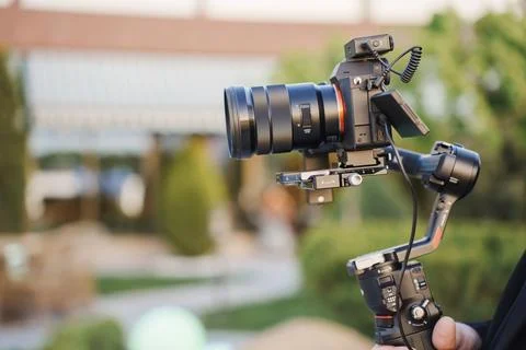 Camera setup in an outdoor location for a shooting session during golden hour Stock Photos