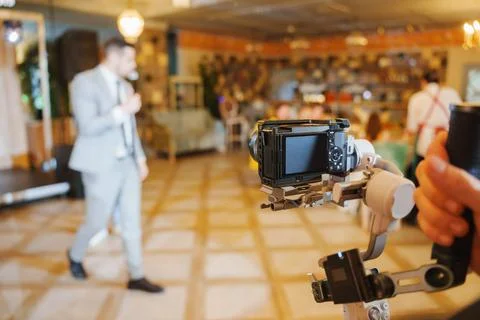 Camera setup for speaker at lively event location Stock Photos
