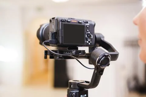 Camera setup on a tripod with a gimbal for steady shooting indoors Stock Photos