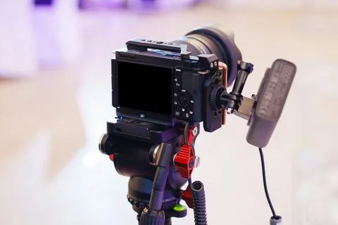 Camera setup on tripod for shooting in studio during event Stock Photos