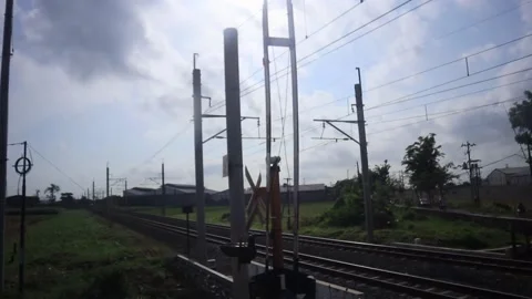 The camera shakes while crossing the railroad tracks. Stock Footage 218430218