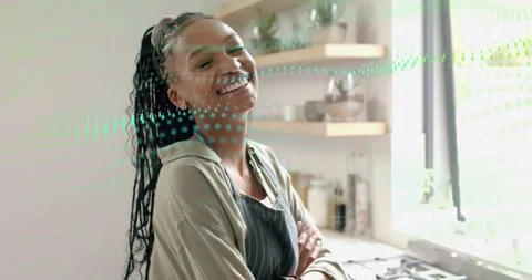 Camera shift revealing woman chef smiling and tilting while green dots passing, Stock-Footage 320895944