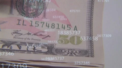 Camera shifting and tilting, revealing stack of US 50 bills while numbers Stock Footage 335651966