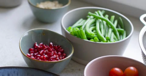 Camera is shifting frame around bowls on countertop, pulling focus to center Stock Footage 337287851