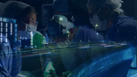 Camera shifting overlay surgical team operating to treat patient lamp tools city Stock Footage 333903336