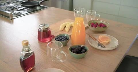 Camera shifting right and zooming in at kitchen island, highlighting orange Stock Footage 342392674