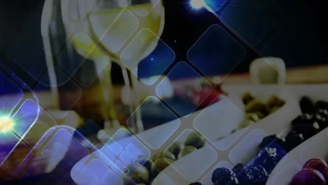 Camera shifting up, tiles drifting right, dish holding olives, wine glass Stock Footage 329751248