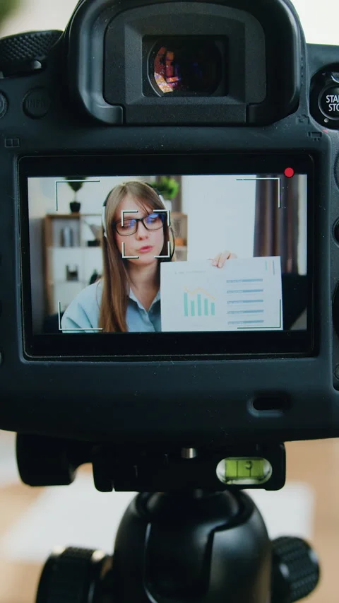 Camera shooting of good-looking confident smart modern young girl in headset whi Stock Footage 325315028