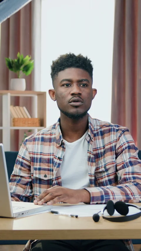Camera shooting of likable confident modern young black-skinned male IT -worker  Stock Footage 325314503