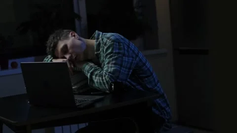 Camera shooting of likable tired overworked man which sleeping on the desk in wo Stock Footage 297189087
