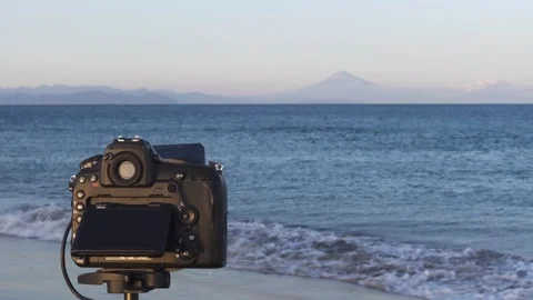 Camera shooting Mount Fuji from the beach at sunset, Shizuoka Prefecture, Japan Stock Footage 151433410
