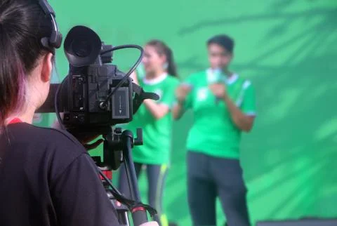 Camera shooting two presenter on stage Stock Photos