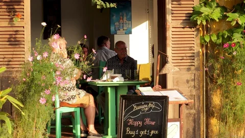 The camera shoots passers-by on a tourist street in Hoi An Stock Footage 128277341