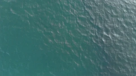 The camera shoots up. Top-down view of the sea waves. Sea ripples. Aerial view Stock Footage 119392707