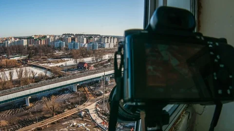 The camera shoots video from the balcony as builders lay tiles Stock Footage 101225237