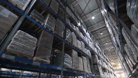 Camera shot of different materials in warehouses racks indoor around: boxes, pal Video stock 199490291