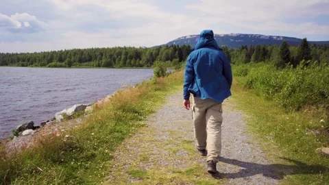 Camera shot of a man running along the shore. Stock Footage 114717081
