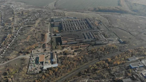 The camera shows a huge construction plant and rises to the horizon. Stock Footage 97142239
