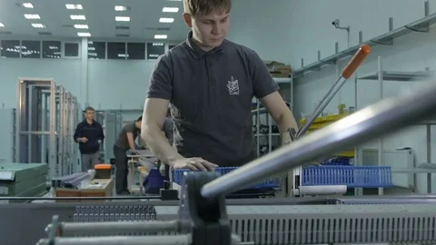 Camera Shows Worker Operating at Plastic Cutting Machine Stock Footage