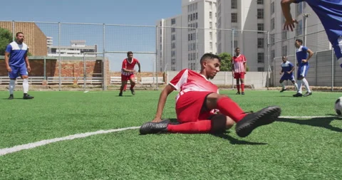 Camera shutter clicking effect against male soccer player dribbling past the Video stock 153476966