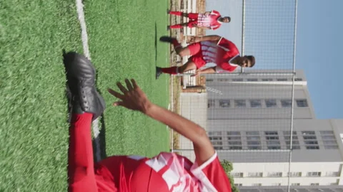 Camera shutter clicking effect against male soccer player dribbling past the Video stock 312320242