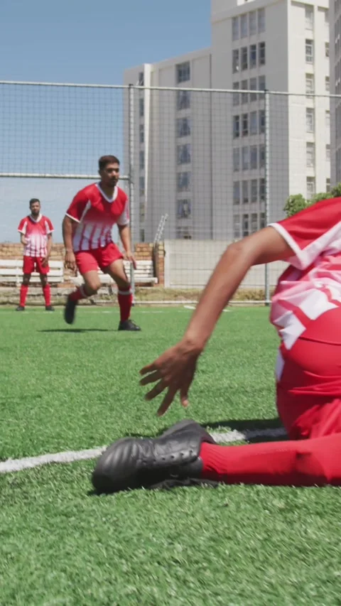 Camera shutter clicking effect against male soccer player dribbling past the Video stock 331646830