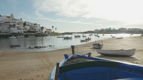 Camera slide over a boat in Ferragudo, Portugal Stock Footage 80118623