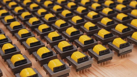 Camera slide over many transformer coils, close up Видео 140114819